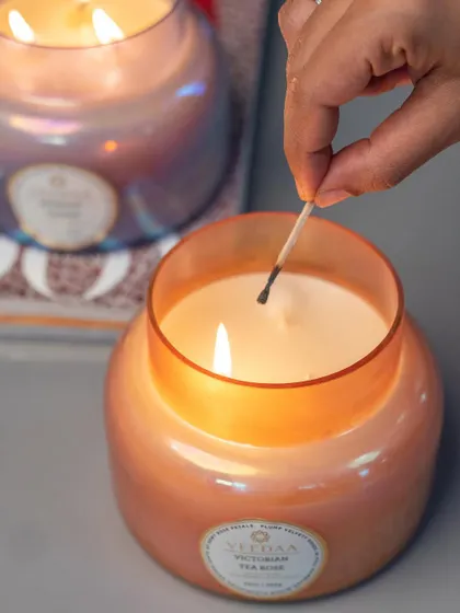 Lighting a Victorian Tea Rose candle to ring in the new year. The soft, romantic fragrance and the beautiful iridescent jar create a magical and celebratory atmosphere.