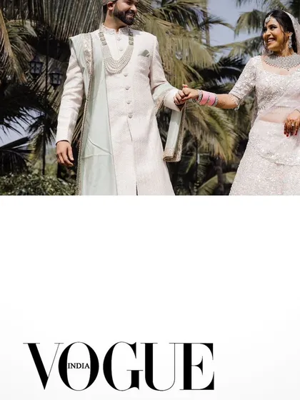 A Vogue-featured shot of the couple walking at their Goa wedding.