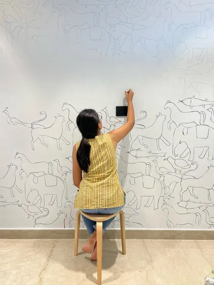 Another shot of me working on the animal doodle mural. The process is intuitive and free-flowing, letting the characters emerge organically across the wall.