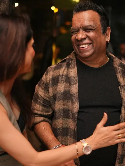 A candid moment of laughter with a friend.