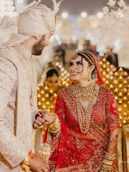 A look of pure love and adoration from the bride to her groom during their wedding ceremony.