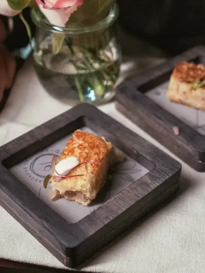 A classic French favorite with my own twist. These Mini Croque Monsieur bites are made with chicken ham, onion jam, fresh jalapeno, and emmental cheese.