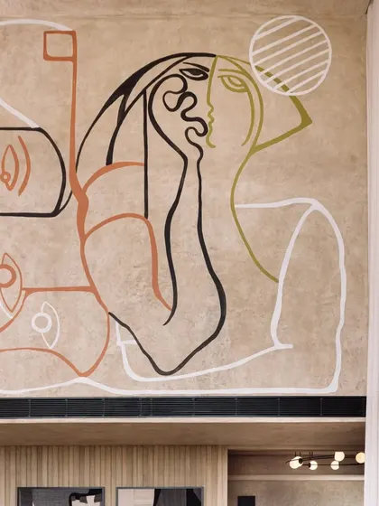 The upper portion of the mural, showcasing a pensive, abstract portrait that adds an emotional layer to the composition.