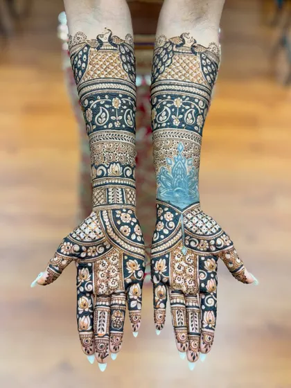 The same design after the paste has been applied to both hands, showing the full, symmetrical artwork.