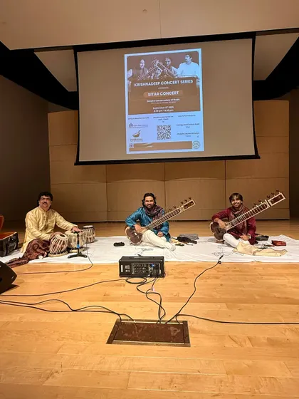 A moment before our concert in Omaha, the first of the tour. The stage is set for a traditional sitar duet, with a projector screen in the back for concert details.