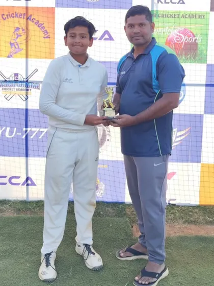 Ganapati receiving the Player of the Match award for his all-round performance in the U-12 tournament.