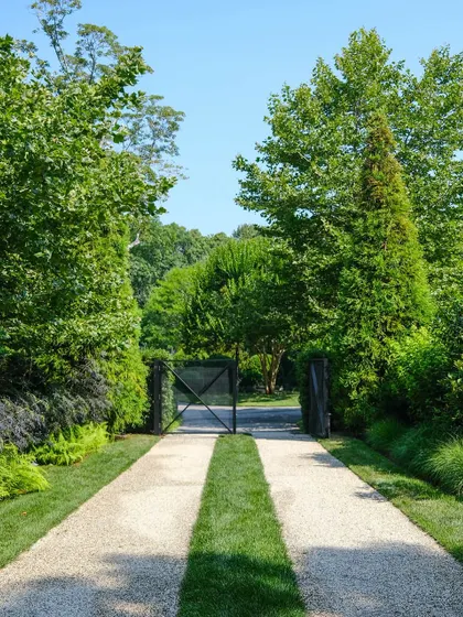 A duplicate image of a unique driveway design that blends gravel and turf. This showcases our ability to create functional yet beautiful entrances that are integrated with the landscape.