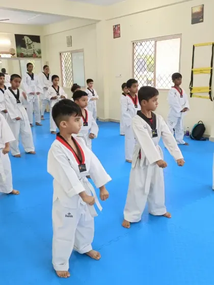 Young students practicing their ready stance.