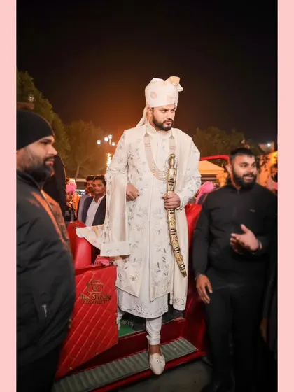 A "Rajputana Wedding" style entry for the groom. This shot captures him making a grand entrance, looking every bit like royalty.