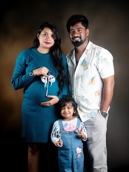 A joyful studio maternity session with the family. The older sibling's excitement is a wonderful part of the story we aim to capture.
