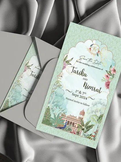 Timeless elegance for your special day. This exquisite static Save the Date card features a beautiful Rajasthani miniature art style, with a palace view framed by a traditional arch and delicate florals.