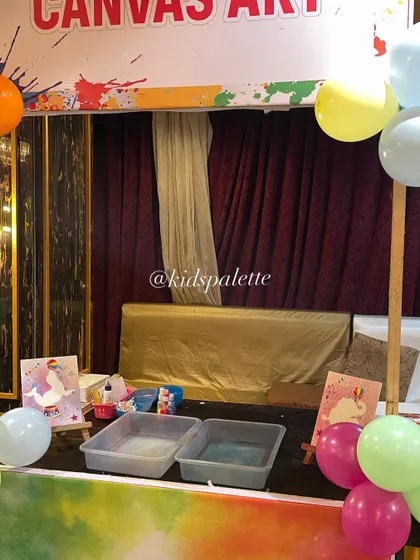 A glimpse of our art party setup with different stations for canvas art and crayon making. Offering a variety of activities keeps all the kids engaged.