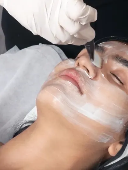 The precise application of a L'AAMIS organic face mask ensures every part of your skin receives its nutrient-rich benefits. This step is crucial for calming, hydrating, and brightening the complexion.