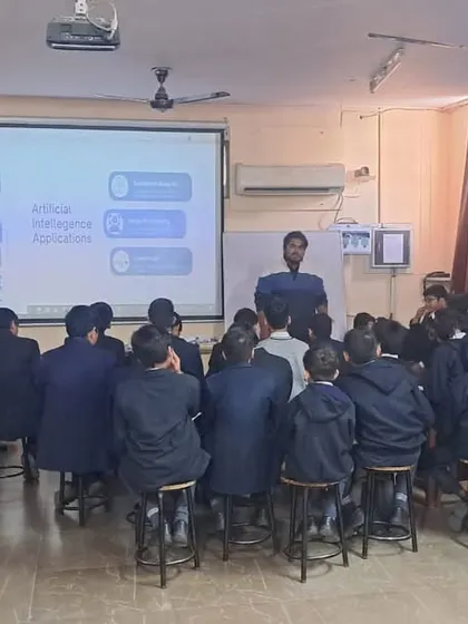 A full classroom of students listens attentively as our instructor leads a session on coding and AI, part of our program to integrate practical tech skills into the school day.
