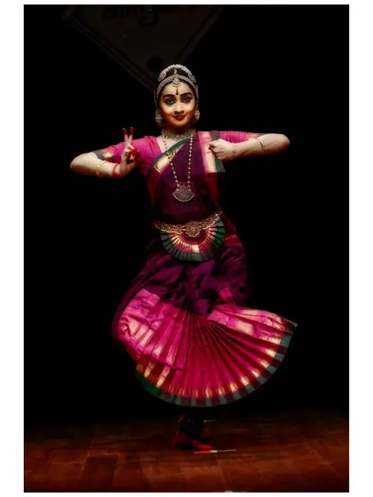 A dynamic pose from a performance at Aikyam 2024. The beauty of Bharatanatyam lies in its ability to be simultaneously strong and graceful, a balance we constantly strive for in our practice.