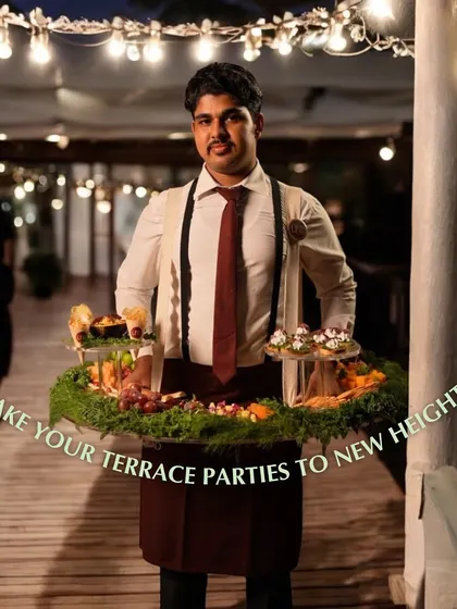 Our floating grazing table is perfect for taking your terrace parties to new heights. A server carries the interactive feast through the party, creating a dynamic and engaging food experience under the stars.