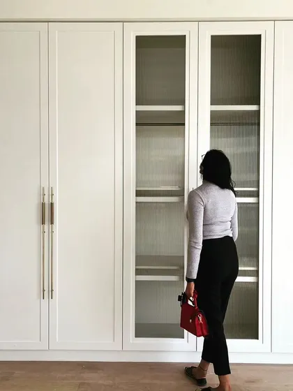 Introducing my colonial-inspired haven in Bangalore! A wardrobe that exudes elegance and a spacious bedroom that invites relaxation.