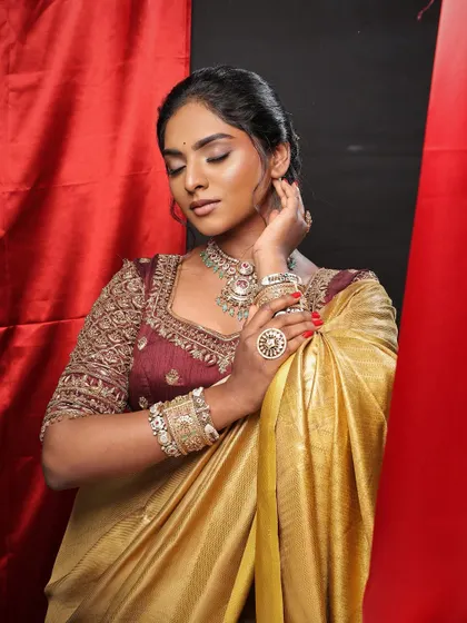 Another beautiful shot from this traditional photoshoot. The makeup is subtle yet effective, creating a flawless canvas that lets her features shine.