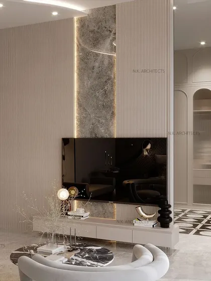 This view highlights the TV unit and wardrobe in the grey curved bedroom. The design maintains its clean lines and sophisticated palette, with a striking black and white floor pattern adding a touch of art deco flair.