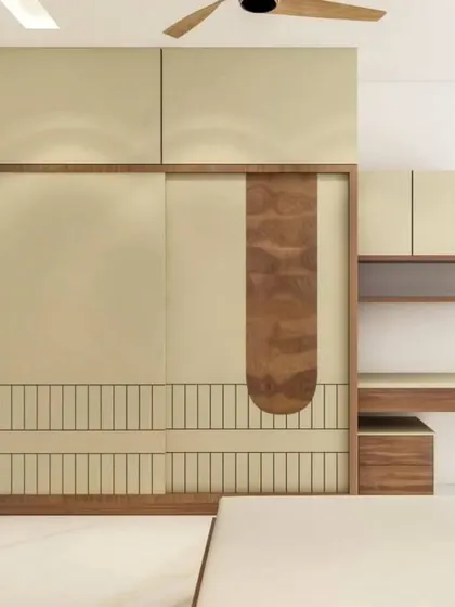 This image shows a custom wardrobe with a unique wood inlay and an integrated study desk, a perfect solution for a compact bedroom.