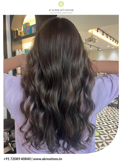 A back view of these beautiful brown highlights, showing the dimension and healthy shine of the hair after our service.