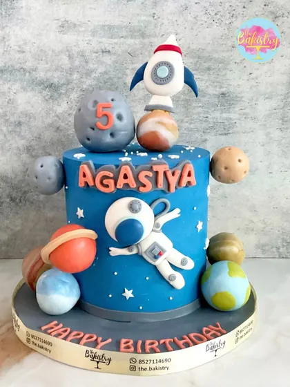 Blast off into a galaxy of deliciousness with this astronaut-themed cake for Agastya's 5th birthday. I handcrafted all the planets of the solar system, a floating astronaut, and a rocket ready for launch.