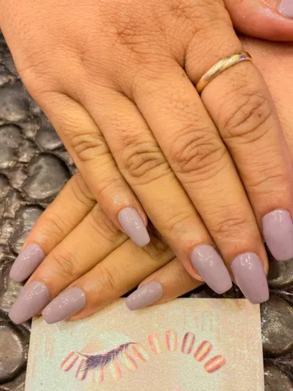 A classic and versatile set of coffin-shaped nails in a solid, muted mauve color. This shade is perfect for a professional yet stylish look.