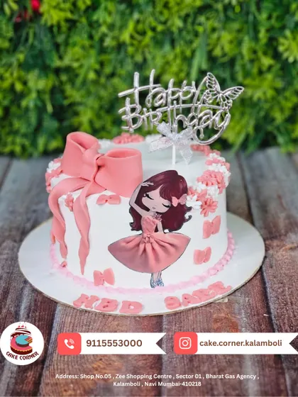 A sweet and simple dancing girl cake with a large pink bow. The butterfly topper adds a touch of grace, making it a lovely choice for a birthday.