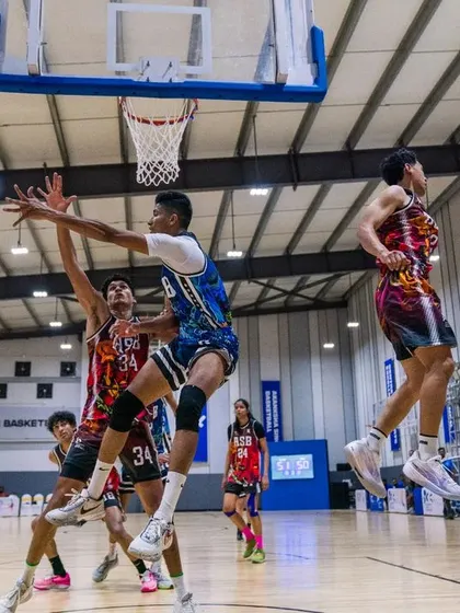 High-flying action as players collide at the rim. Our games are packed with athleticism and spectacular plays.