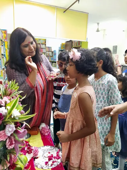 A close-up moment of interaction during the Ganesha pooja. I love explaining the meaning behind the rituals to the curious young minds.
