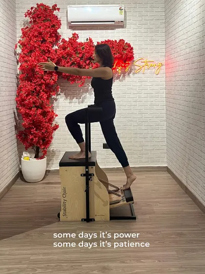 A member uses the Stability Chair for a step-up exercise, a move that builds leg strength, balance, and control.