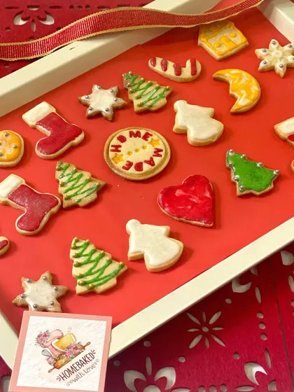 Our 'Home Made' Christmas cookie, taking centre stage among a tray of other festive designs. This little detail reflects our core value of providing homemade goodness in every bite.