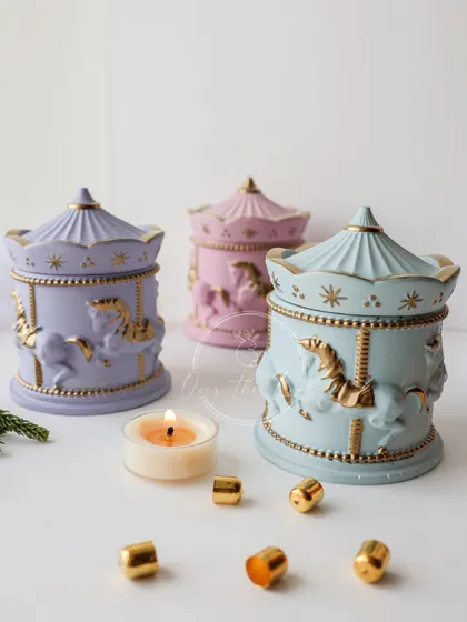 My merry-go-round jars, adorned with liquid gold, are perfect for storing fine jewelry or other trinkets. They can also be filled with a custom-scented candle.