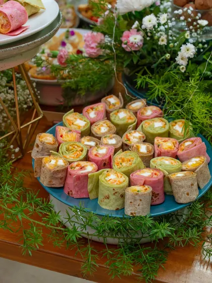 Colorful pinwheel wraps filled with fresh vegetables and cheese. This vibrant platter adds a playful and delicious touch to any event, showcasing our versatility.