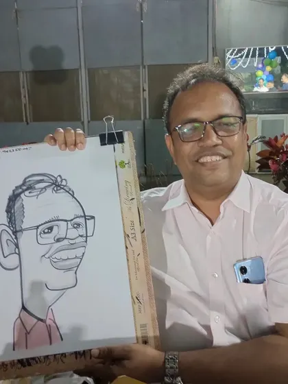 The host of the party, Dr. Sandeep, was kind enough to pose for a caricature himself.