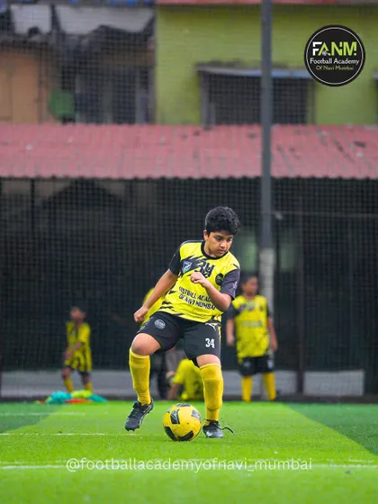 A young player works on his dribbling, demonstrating the skills he's learned at the academy. I focus on building a strong technical foundation in all my players.