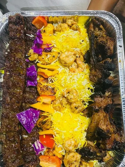 A glimpse of our exquisite Turkish Platter, a vibrant and flavorful assortment of grilled meats, kebabs, and fresh accompaniments. It's a perfect centerpiece for any gathering, offering a unique culinary journey.