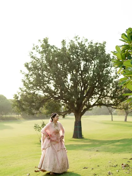 A serene portrait of the bride in a beautiful open field. The natural setting provides a simple and stunning backdrop.