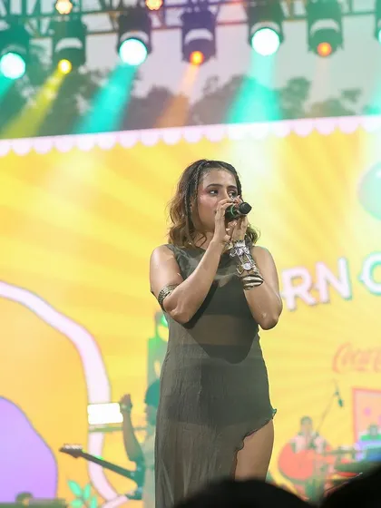 A close-up of Shreya Jain singing at the Horn OK Please festival. This shot captures her focus and the emotion of her performance.