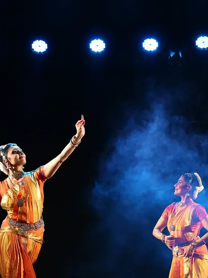 A dramatic, smoky shot from the "Sarvasya" performance in Mangalore, highlighting the theatricality of the production.