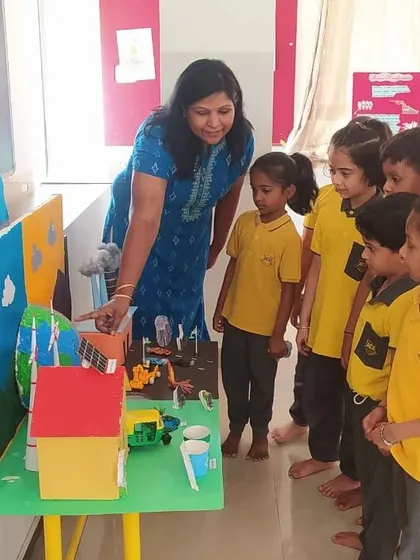 Learning about renewable energy sources like solar power with a model of a community. I aim to introduce children to important, modern concepts in an age-appropriate and engaging way.