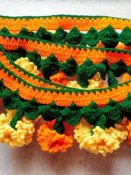 Here are several layers of my handmade marigold and mango leaf torans, ready to be packed. This design is one of my most popular for its full, traditional appearance.