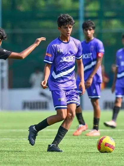 A player calmly controls the ball in midfield during the DPDL finals.