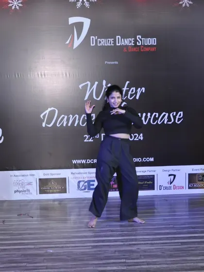Another dynamic shot of Pooja's solo dance performance.