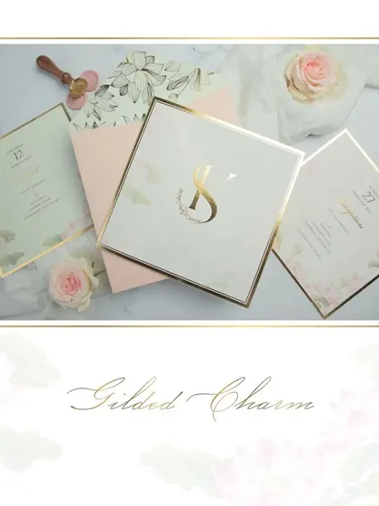 We named this suite 'Gilded Charm'. It features a soft, romantic design with a prominent gold-foiled initial, pastel florals, and a beautiful floral envelope liner.