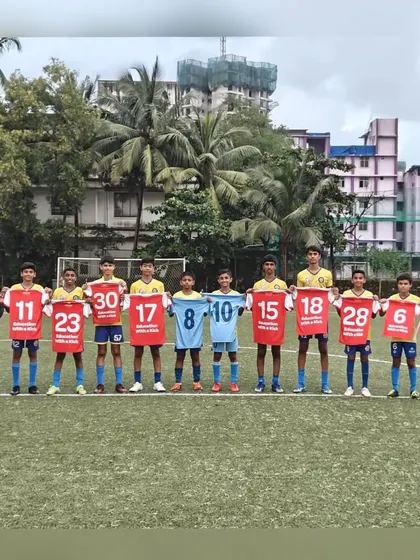 Players holding up the jerseys of the clubs they now represent, a visual representation of their journey from our grassroots program to competitive youth leagues.