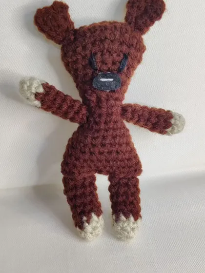 Another pose of the iconic teddy bear plushie.