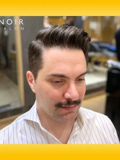 The classic pompadour is timeless for a reason. This style requires precision in both the fade and the styling on top to create that signature volume and clean side part. It’s a sophisticated look for any modern gentleman.