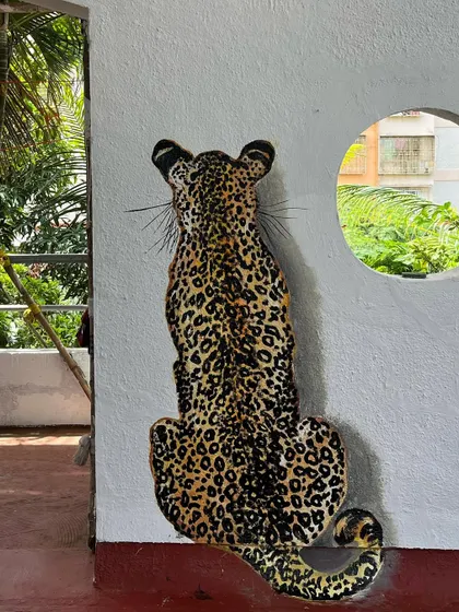 I had so much fun painting this leopard mural on our terrace. It's so realistic that it scares people the first time they see it!