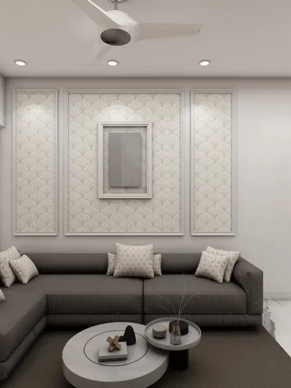 A minimalist living room with a large grey sectional sofa and a textured wall panel, creating a serene and sophisticated space for relaxation.